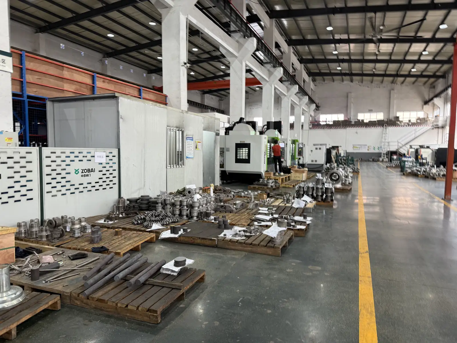 ZOBAI factory floor with CNC machines and work-in-process parts